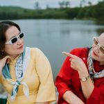 women sitting on boat enjoying time together because of healthy boundaries