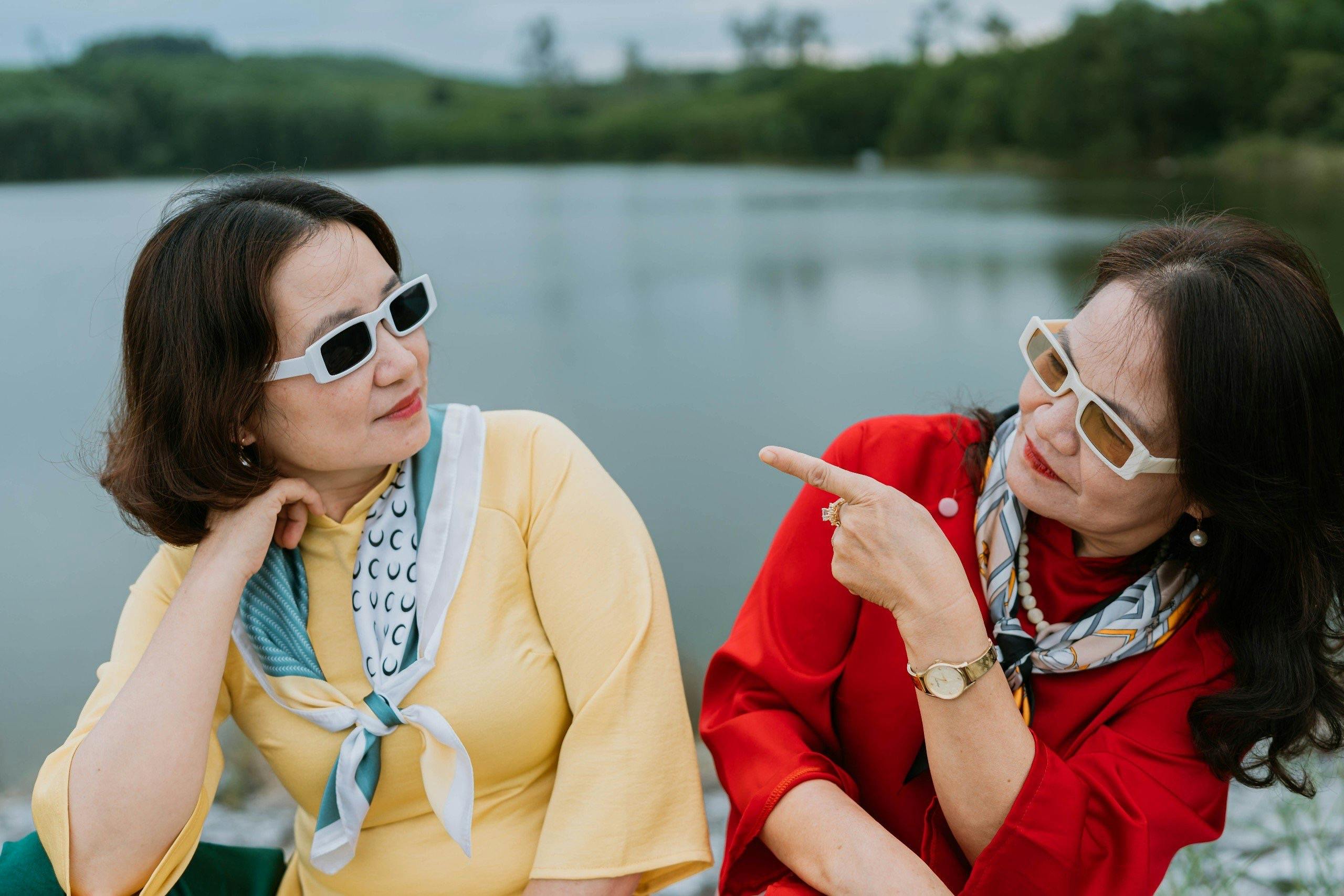 women sitting on boat enjoying time together because of healthy boundaries